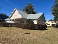 Charming single-story home with well-maintained lawn and mature landscaping at 8569 Sw 92Nd Ln # F, Ocala, FL 34481