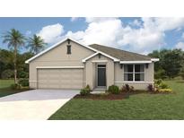 Single-story home with a two-car garage and landscaped front yard at 354 Hickory Course Trl, Ocala, FL 34472