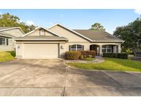 Single-story home with attached garage and landscaped yard at 4480 Nw 79Th Terrace Rd, Ocala, FL 34482