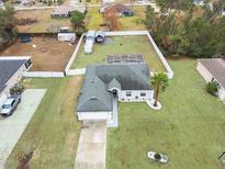 Discover this charming home with a screened-in lanai and a spacious, fenced backyard, perfect for outdoor enjoyment at 4880 Sw 106Th St, Ocala, FL 34476