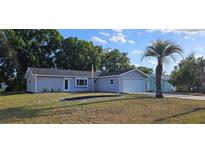 Charming single-story home with a well-manicured lawn and a one-car garage at 8512 Sw 107Th Pl, Ocala, FL 34481
