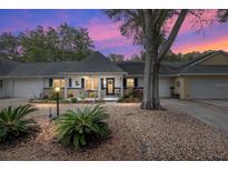 Inviting house exterior featuring a charming front porch and well-manicured landscaping at 8723 Sw 93Rd Ln # C, Ocala, FL 34481