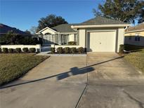 Single-story home with attached garage and manicured lawn at 11120 Sw 71St Terrace Rd, Ocala, FL 34476