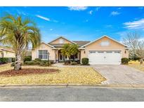 Two-car garage and attractive curb appeal at 8796 Sw 83Rd Cir, Ocala, FL 34481