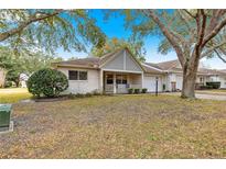 Cute condo with a covered porch and well-manicured lawn at 9662 Sw 95Th Ct # A, Ocala, FL 34481