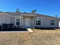 One-story house with gray siding and a small front yard at 2792 Sw 161St Loop, Ocala, FL 34473