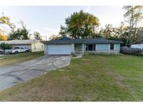 Cute ranch home with a large yard and a 1 car garage at 6006 Nw 62Nd Pl, Ocala, FL 34482