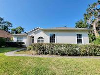 Charming single-story home with well-maintained landscaping and a bright, inviting facade at 1908 Sw 28Th St, Ocala, FL 34471