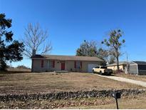 Single-story house with attached garage and a spacious yard at 200 Nw 53 Ct, Ocala, FL 34482