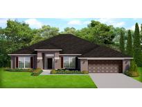 One-story home with brown roof, shutters, and garage at 7067 Hemlock Crse, Ocala, FL 34472