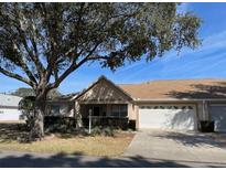 Single-story home with attached garage and carport at 9827 Sw 96Th St, Ocala, FL 34481