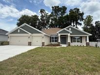 Charming single-Gathering home with a 3-car garage, landscaped yard, and inviting curb appeal in a well-maintained neighborhood at 7 Nw 45Th Loop, Ocala, FL 34470