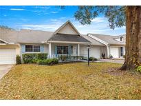 Charming villa with a covered porch and well-maintained lawn at 8785 Sw 91St St # B, Ocala, FL 34481