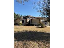 One-story home with stone accents and a large yard at 9143 Sw 70Th Loop, Ocala, FL 34481