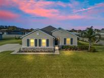 Attractive one-story home with a landscaped lawn and driveway at 6267 Se 13Th St, Ocala, FL 34472