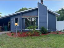 Charming single-Gathering home with blue siding, a chimney, and well-maintained landscaping at 1804 Sw 29Th Ter, Ocala, FL 34474