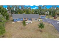 Aerial view of a ranch-style home with detached garage and large lot at 4301 Se 38Th St, Ocala, FL 34480