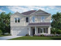 Two-story house with light beige siding, gray roof, and a two-car garage at 3992 Ne 31St Ave, Ocala, FL 34479