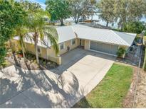 Charming one-story brick home with a well-manicured front yard and a spacious driveway at 10900 Se Timucuan Rd, Summerfield, FL 34491