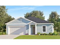 Charming single-story home features a two car garage, light blue siding, and a well-manicured front lawn at 4725 Sw 83Rd Loop, Ocala, FL 34476