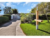 Charming single-story home with a well-manicured lawn, mature trees, and a classic mailbox at 10958 Sw 86Th Ct, Ocala, FL 34481