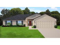 Charming single Gathering home with a two-car garage, manicured lawn and lovely landscaping at 120 Dogwood Drive Cir, Ocala, FL 34472