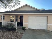 Charming single-story home featuring a one-car garage, covered entry and mature landscaping at 9638 Sw 94Th Ct # A, Ocala, FL 34481