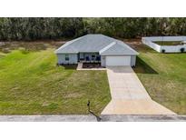 Charming single-story home with well-manicured lawn and inviting front entrance at 1482 Ne 160Th Pl, Citra, FL 32113