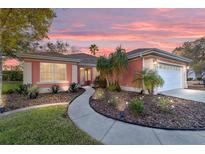 Charming single-story home with a well-manicured front yard and walkway, showcasing its inviting curb appeal at 13625 Se 93Rd Court Rd, Summerfield, FL 34491