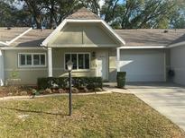 Charming single-story home with a well-manicured front yard and attached one-car garage in a quiet neighborhood at 9535 Sw 85Th Ter # C, Ocala, FL 34481