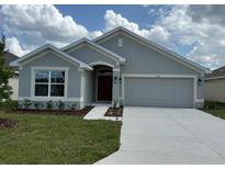 Charming single-story home with a well-maintained lawn and two car garage at 2150 Nw 23Rd Loop, Ocala, FL 34475