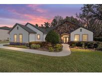 Charming single-story home with stone accents, manicured lawn, and inviting walkway at 4103 Se 10Th Ave, Ocala, FL 34480