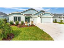 Charming single-story home with well-manicured lawn, three-car garage, and inviting curb appeal at 503 Verlander St, The Villages, FL 34762