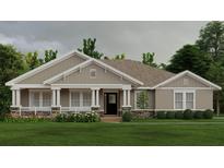 Charming single-story home featuring a welcoming front porch and stone accents for added curb appeal at 1929 Nw 85Th Loop, Ocala, FL 34475