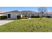 Charming single-story home with a well-maintained lawn and inviting curb appeal at 5040 Nw 35Th St, Ocala, FL 34482