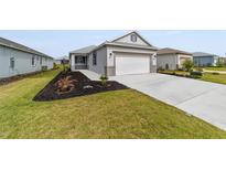 Charming single-Gathering home with a well-manicured lawn and a two-car garage at 8769 Sw 79Th Pl, Ocala, FL 34481