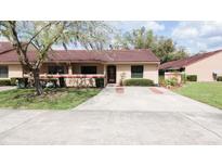 Charming single-story home with a well-maintained lawn and a spacious driveway at 3447 Sw 19Th Pl, Ocala, FL 34474