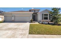Charming single-story home with a well-maintained lawn, two car garage, and inviting front garden at 8371 Sw 59Th Ter, Ocala, FL 34476