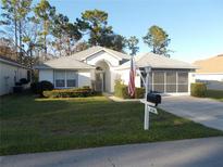 Charming single-story home with well-manicured lawn and inviting curb appeal at 11665 Sw 72Nd Cir, Ocala, FL 34476
