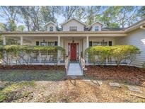 Inviting single-story home with a covered front porch, perfect for relaxation and curb appeal at 3060 Ne 35Th St, Ocala, FL 34479