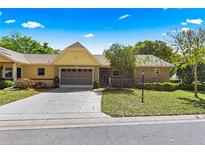 Charming single-story home with a two-car garage and well-maintained landscaping at 9365 Sw 89Th Ter # F, Ocala, FL 34481
