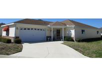 Charming single-story home with a two-car garage and well-maintained landscaping at 13686 Sw 111Th Ave, Dunnellon, FL 34432