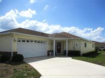 Charming single-story home with a well-manicured lawn and an attached two-car garage at 13686 Sw 111Th Ave, Dunnellon, FL 34432
