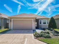 Charming single-story home featuring a well-manicured lawn and a neutral-toned exterior paint scheme at 3312 Sw 38Th Pl, Ocala, FL 34474