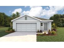 Charming one-story home with a two-car garage, well-manicured lawn, and beautifully landscaped front yard at 2159 Ne 28Th Ln, Ocala, FL 34470