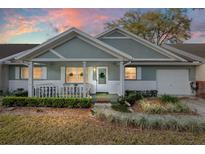 Charming home featuring a welcoming porch and a well-maintained front yard with fresh landscaping at 8533 Sw 93Rd Pl # C, Ocala, FL 34481