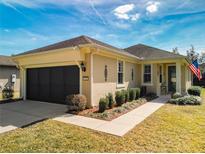 Charming single-story home features a well-maintained lawn, a two-car garage and manicured landscaping at 9346 Sw 73Rd St, Ocala, FL 34481