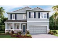 Charming two-story home with blue shutters, stone accents, and a two car garage at 4236 Sw 53Rd Lane Rd, Ocala, FL 34474