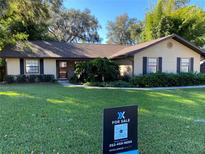 Charming single-story home featuring a well-maintained lawn and mature landscaping at 4780 Se 33Rd Ave, Ocala, FL 34480