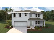 Charming two-story home with a well-manicured front yard and attached two-car garage at 7109 Se 113Th Ln, Belleview, FL 34420